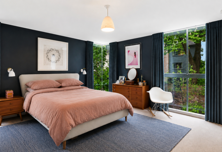 Modern mid century styled bedroom with full length windows, Stockport
