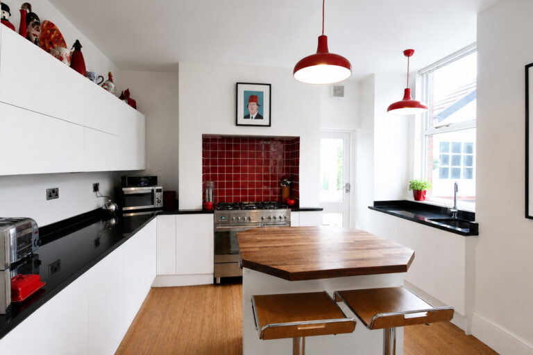 Simple and striking modern kitchen. iroko island unit, Stockport